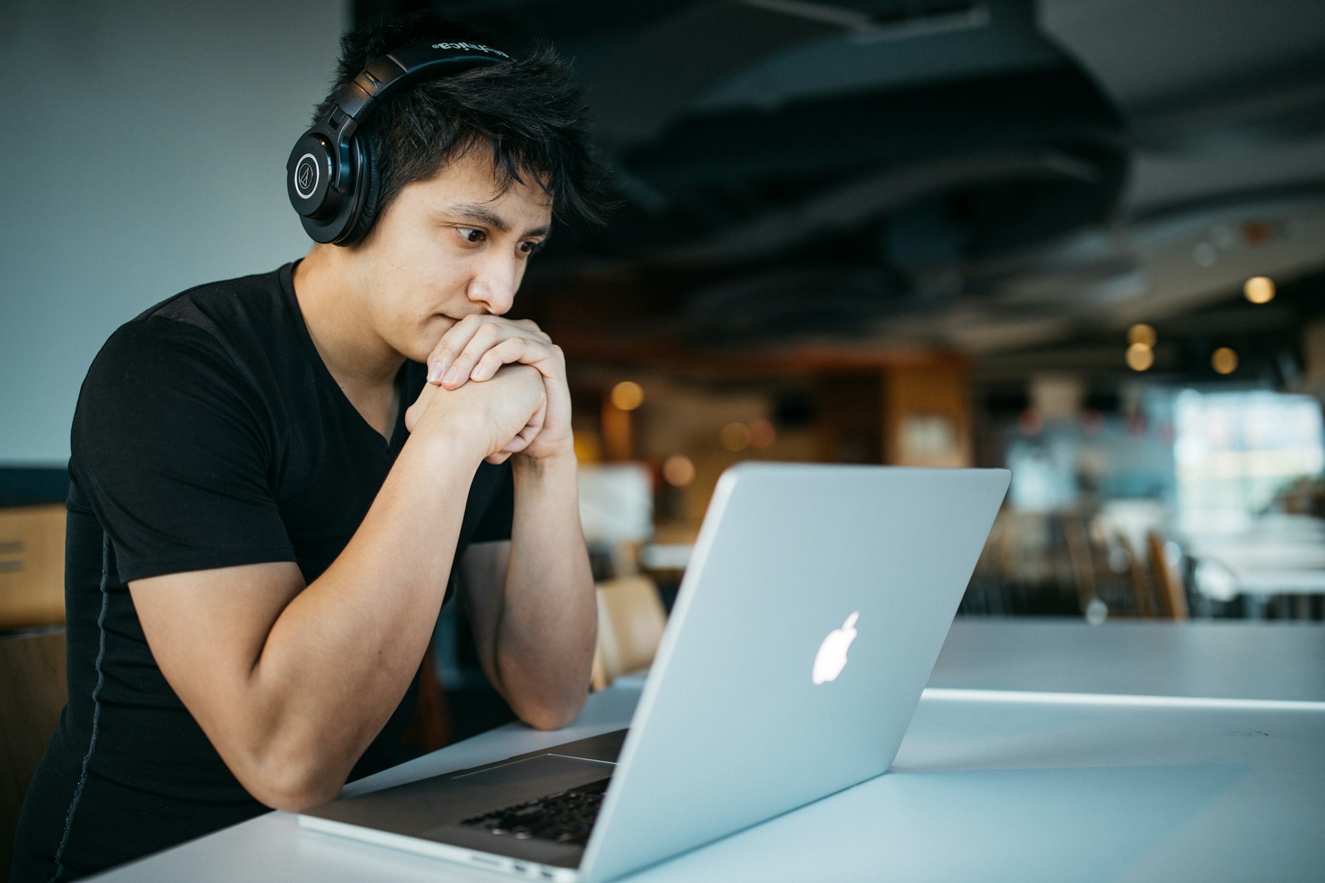 man is doing Computer based practice test on his macbook